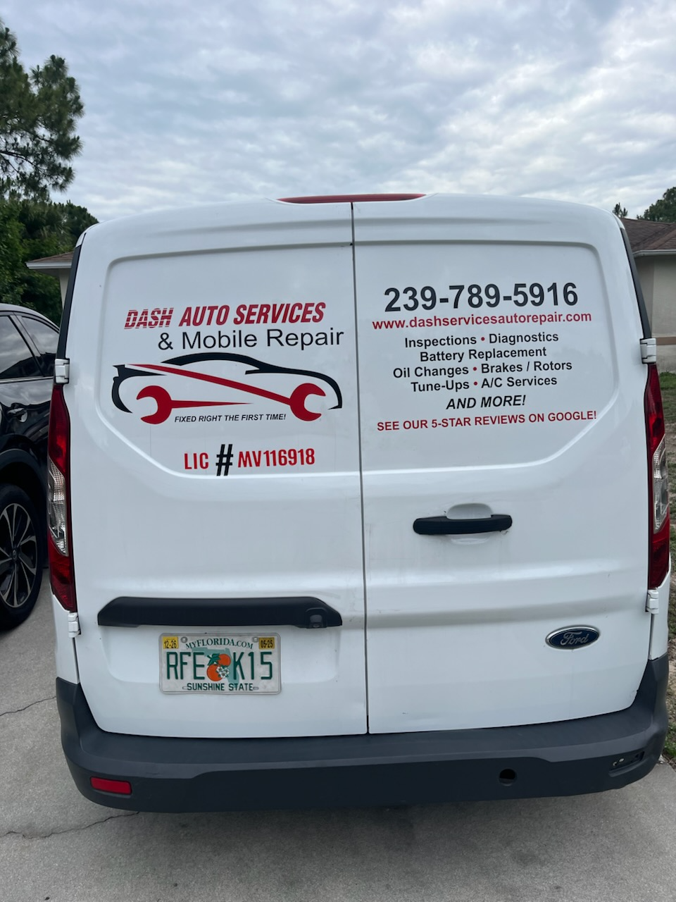 Rear of the Dash Auto Services mobile repair van showing phone number 239-789-5916 and Florida license MV116918